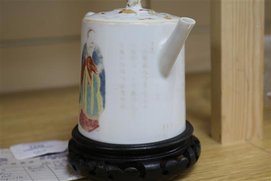 A Chinese famille rose teapot and cover, Daoguang period, wood stand teapot 11cm.